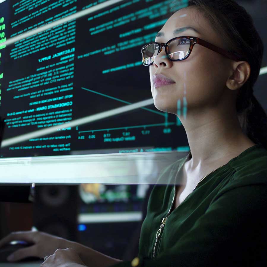 Woman looking at software code