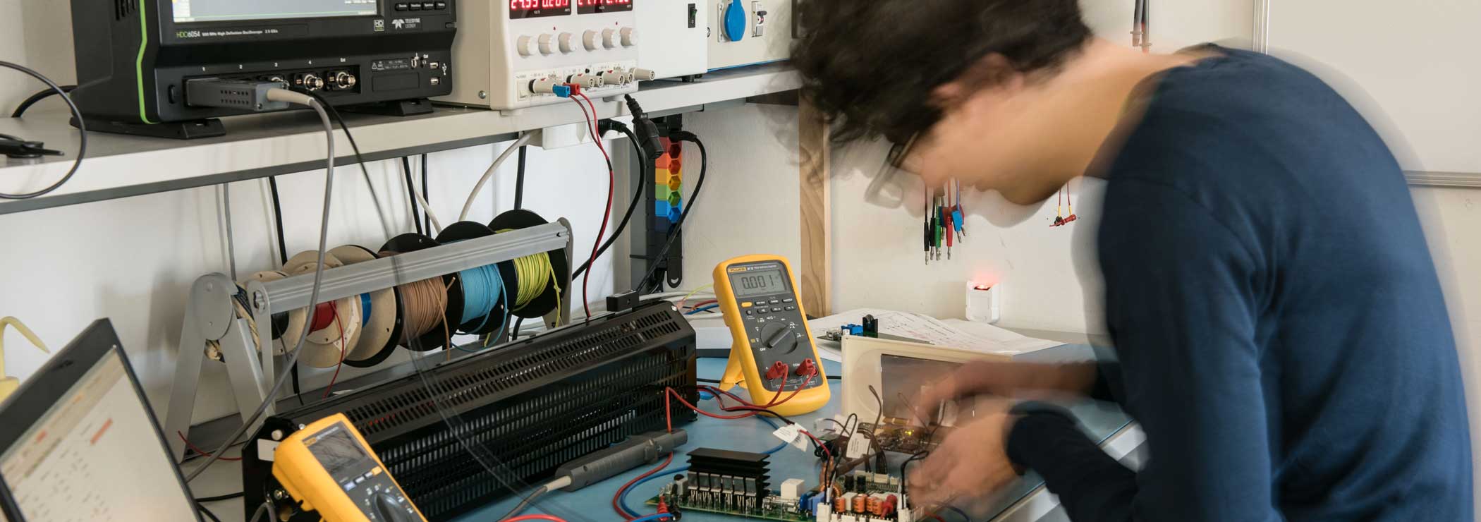 Engineer tests an electronic circuit